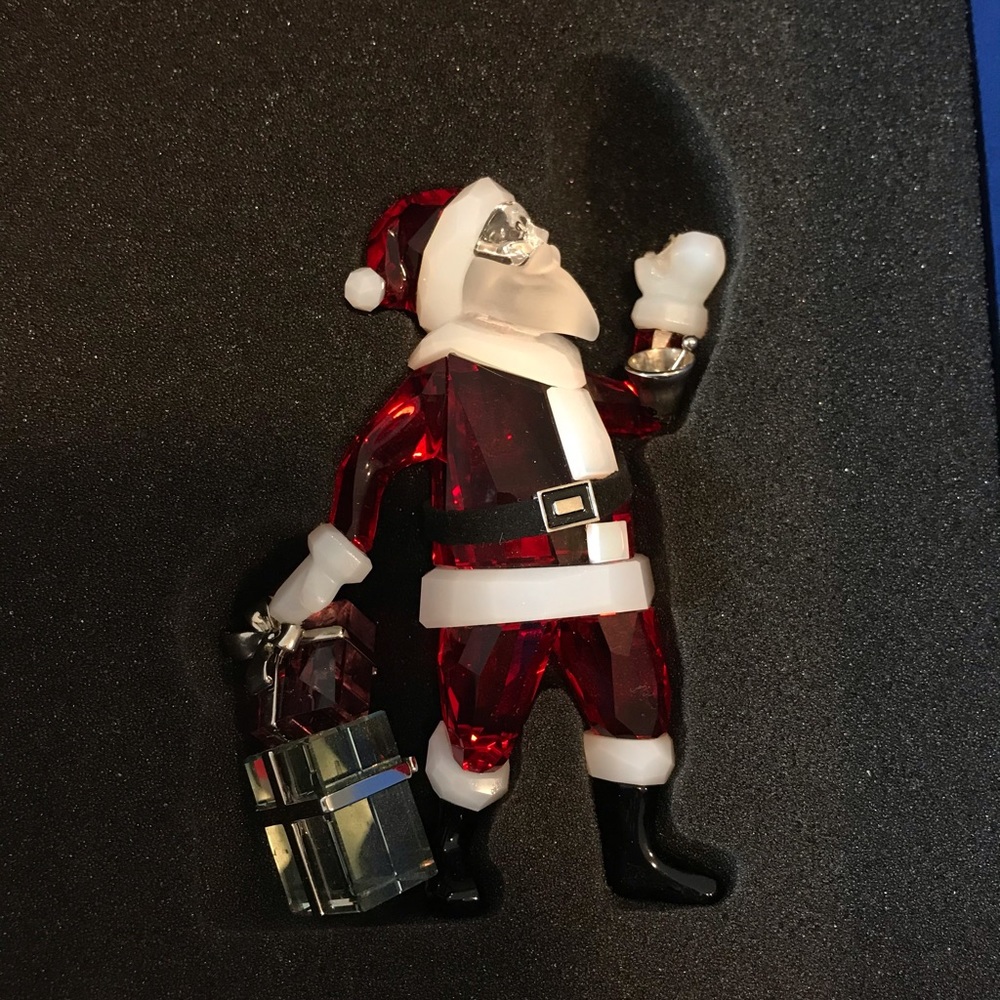 Swarovski Santa it’s bell and gift are detached from Santa